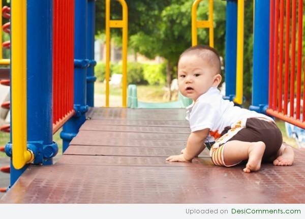 Baby Playing On Ramp