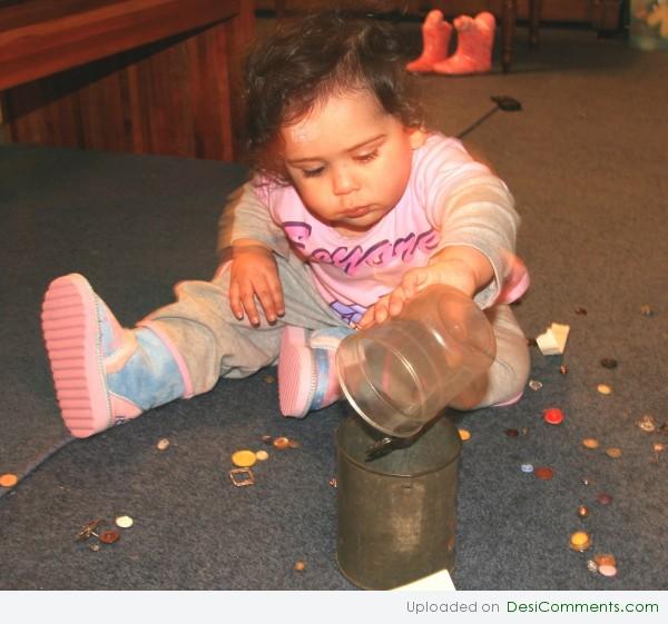 Baby Playing With Mug