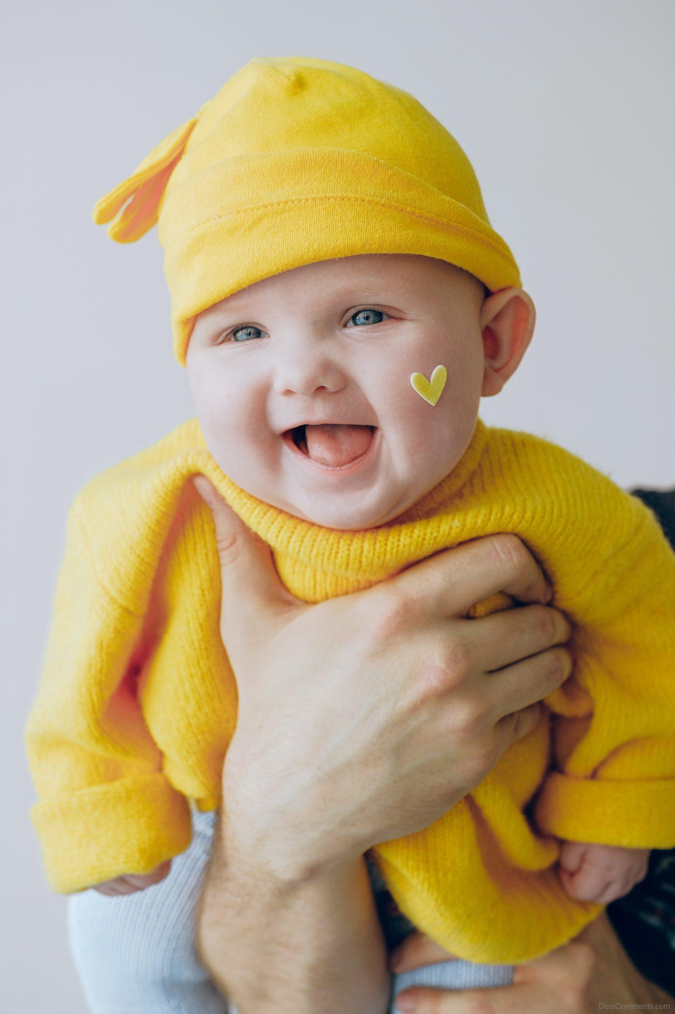 Baby In Yellow Outfit - DesiComments.com