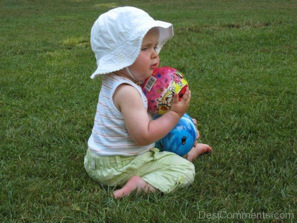 Baby Playing With Balls - DesiComments.com