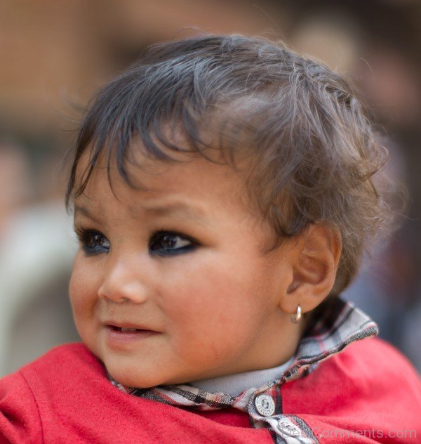 Baby with black lined eyes