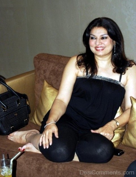 Kiran Juneja Sitting On Sofa