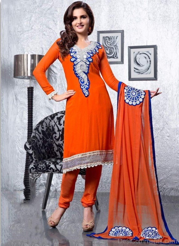 Monica Bedi In Orange  Suit