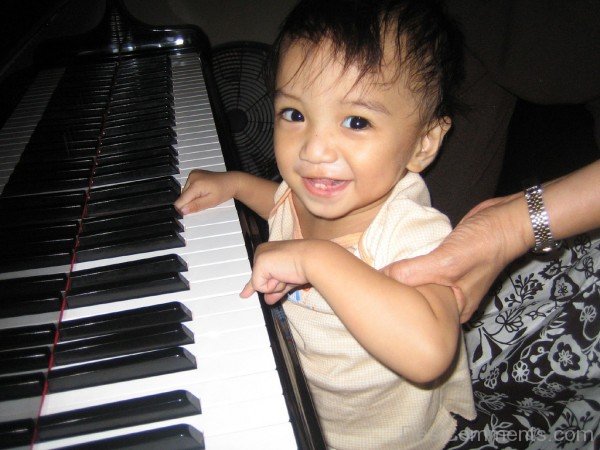 Sweet Baby Playing Piano